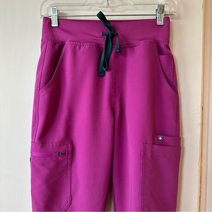 Yola High Rise Skinny Technical Collection Scrub Pants in pink with teal tie